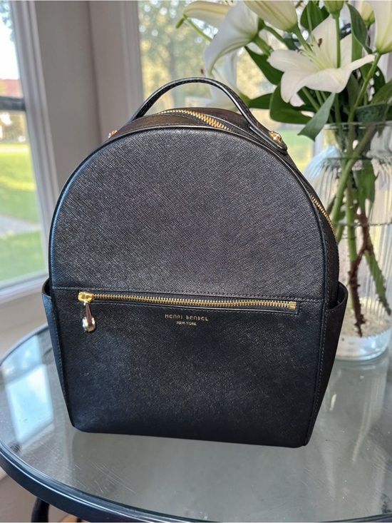 black saffiano leather mini backpack Rucksack PRADA With two compartments Leather handle Adjustable woven nylon harness Enameled metal triangle logo on the front Zipper closure Two external zipper pockets Padded mesh fabric and trolley band on the back Interior with zipper pocket and patch pocket Re. Prada Re-nylon And Saffiano Leather